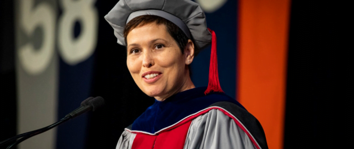 Candis Callison addressing Ph.D. recipients on June 7 at the 2018 hooding ceremony